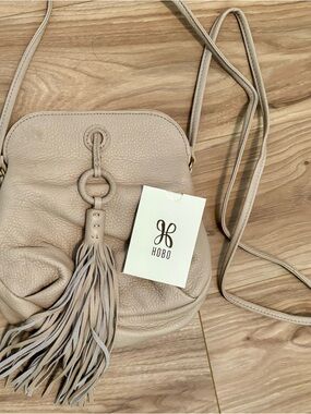 HOBO Pebbled Leather Tassel Crossbody in Light Beige